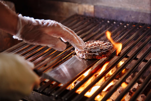 Grilling a burger patty 